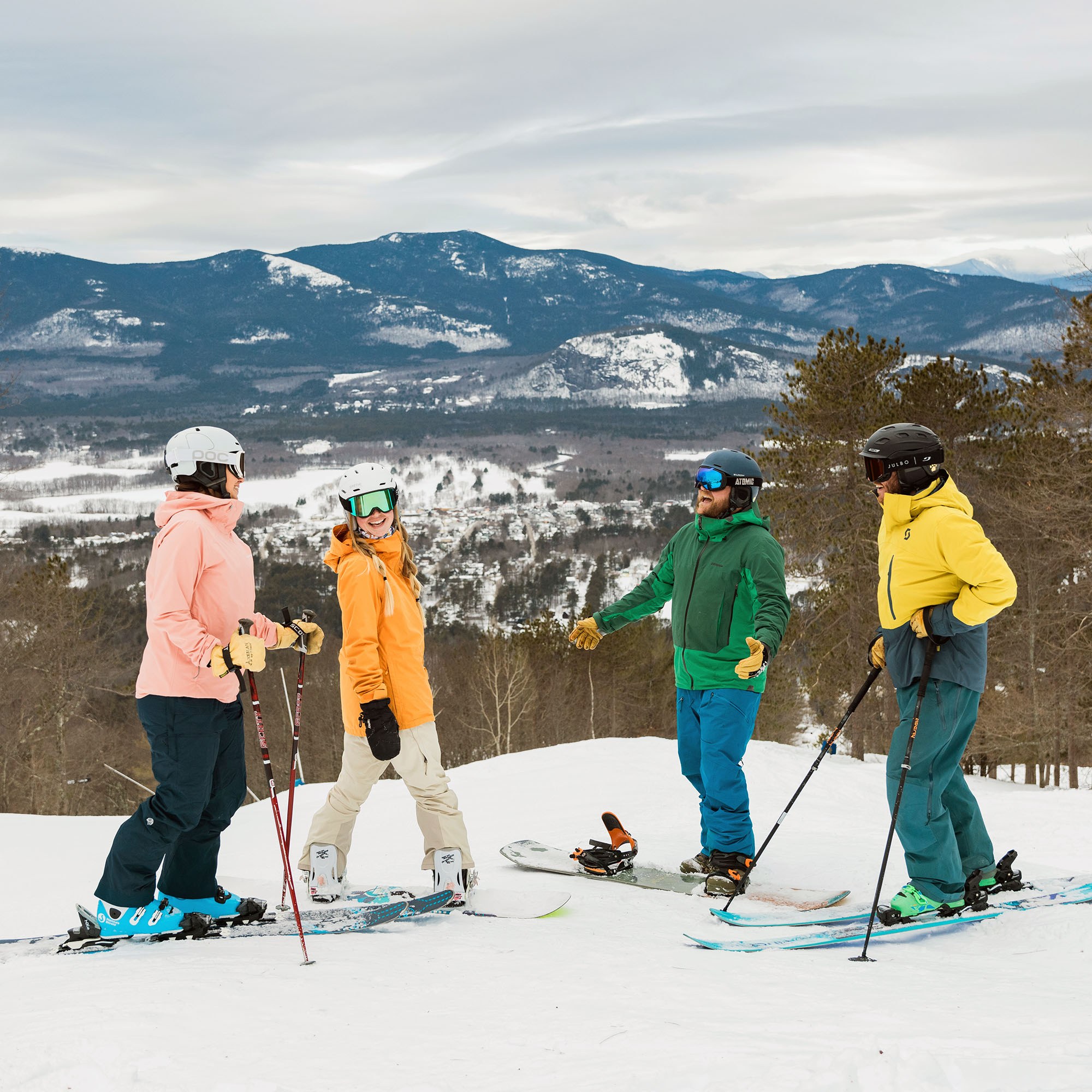 two skiers and two snowboarders